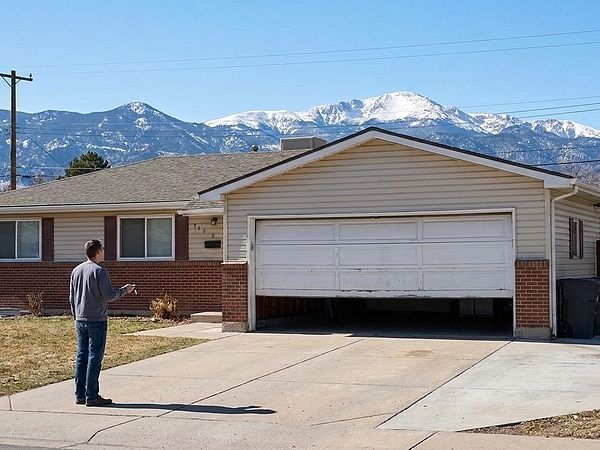 What Causes a Garage Door in Denver to Open by Itself?