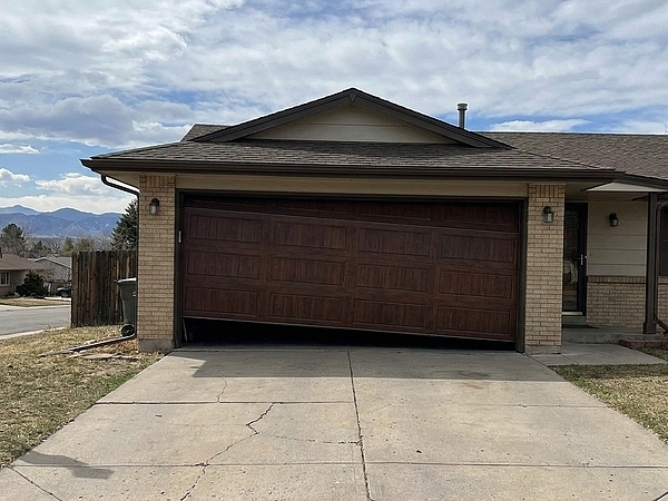 Why Is My Garage Door in Denver Crooked When It Closes?