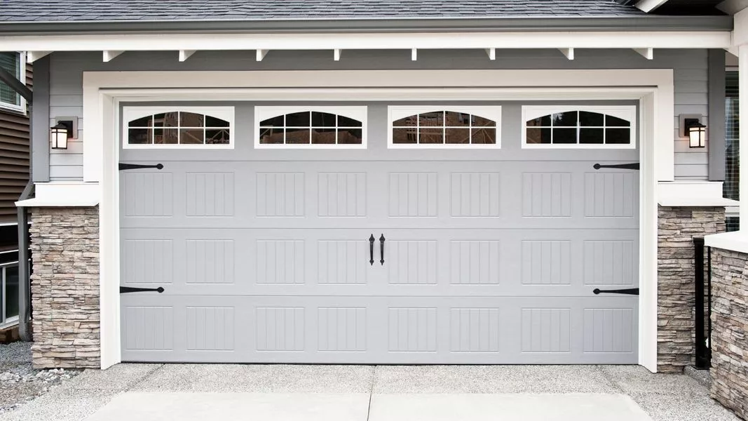 This scene from Lakewood, CO shows a door leading to a white door with a white door. with features such as garage door services garage door repair garage door installation garage door spring repair new garage doors.