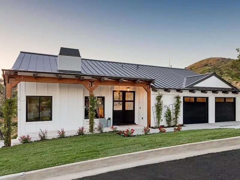 This scene from Lakewood, CO shows a house with a large window and a large building. with features such as garage door services garage door repair garage door installation garage door spring repair.