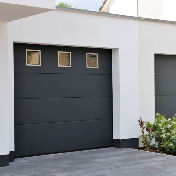 This scene from Lakewood, CO shows a door is open to a large room with a large window. with features such as garage door services garage door repair garage door installation garage door spring repair new garage doors.