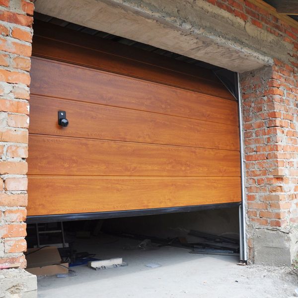 a wooden door with a wooden frame. features garage door services garage door repair garage door installation provided by Retrak Door Service.