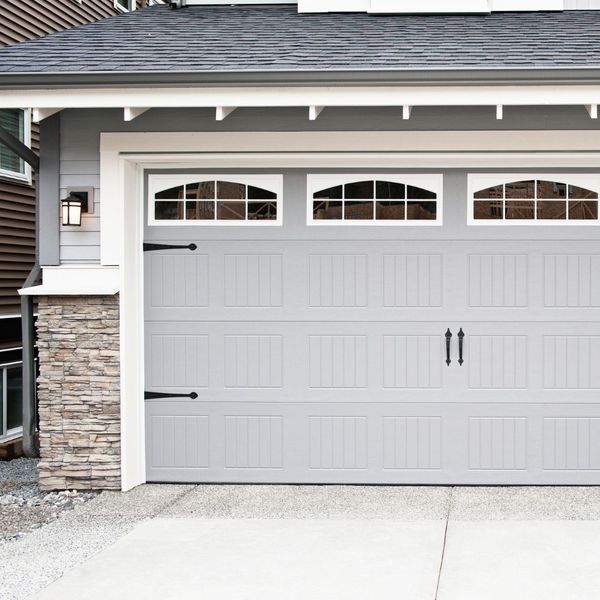 This scene from Lakewood, CO shows a white door leading to a white house. with features such as garage door services garage door repair garage door installation.