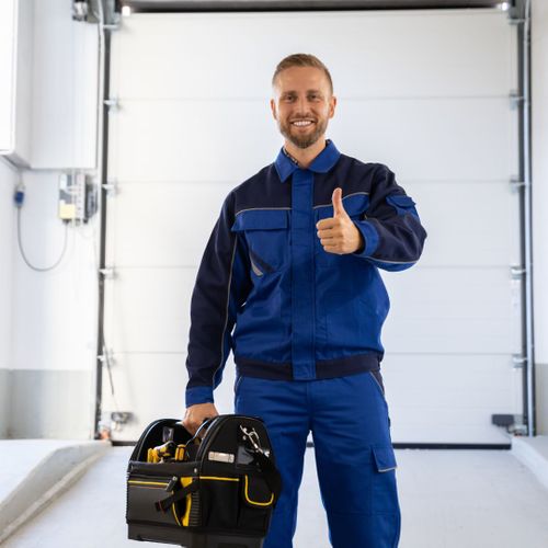 A man in a suit and tie standing next to a white suitcase. showcasing features like garage door services garage door repair garage door installation garage door spring repair new garage doors emergency garage door service.