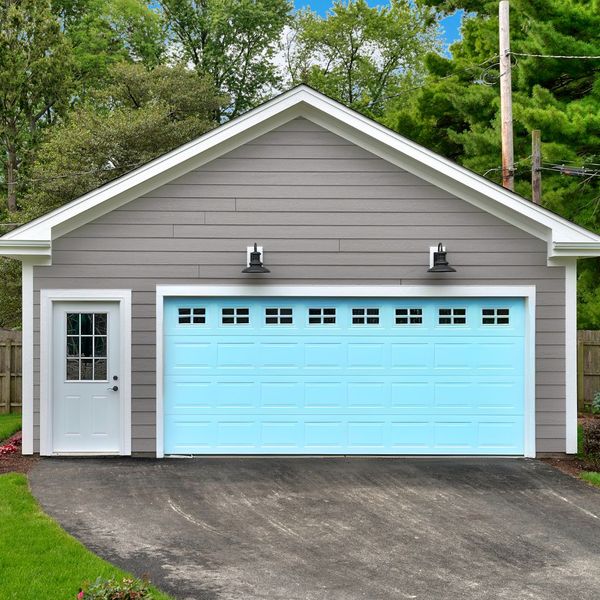 A house with a blue roof and a blue house. showcasing features like garage door services garage door repair garage door installation garage door spring repair.